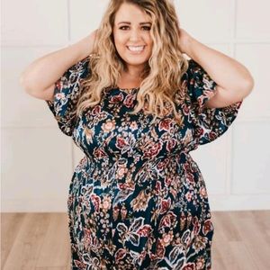 Green silk paisley dress.  Cinched waist but not extra give in the material.